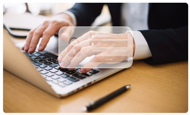 Professional typing on a laptop with a login overlay